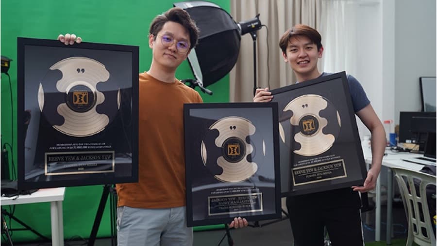 Two Comma Club plaques